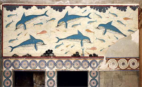 The Spiritual Meaning of Dolphins displayed on an ancient wall artwork