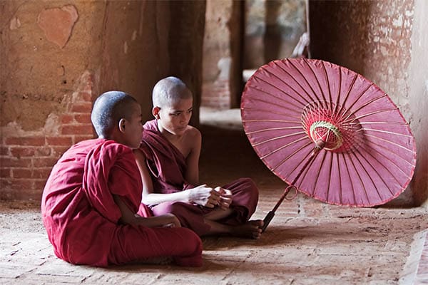 two buddhist monks with shaved heads