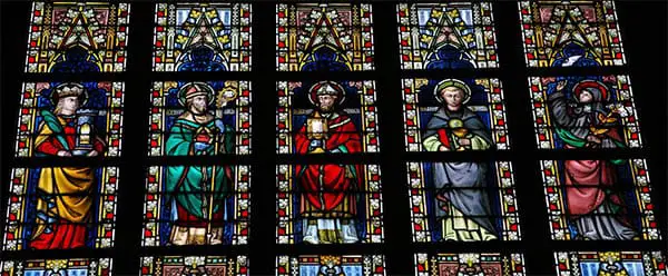 stained glass showing catholic saints