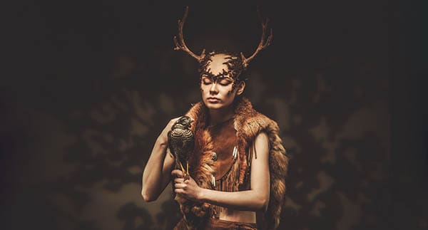 shaman wearing deer antlers