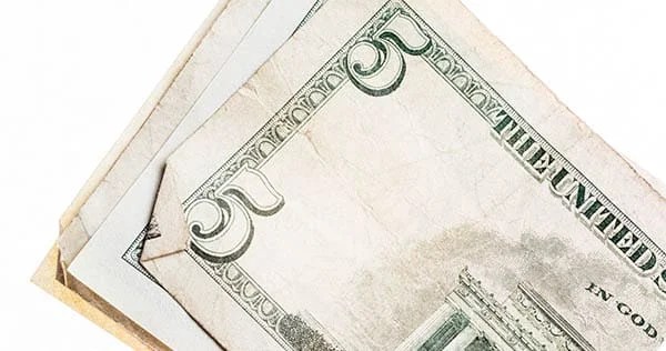 close up of the number five on the five dollar bill
