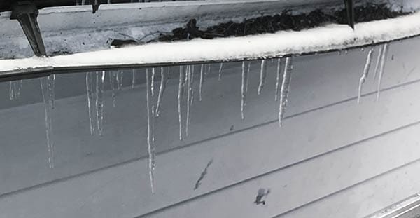 icicles hanging from a gutter