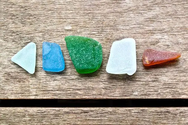 sea glass set upon a wooden table