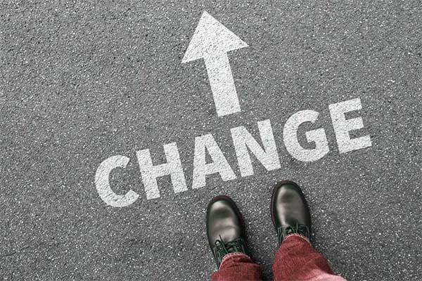 the word "change" printed on the asphalt 